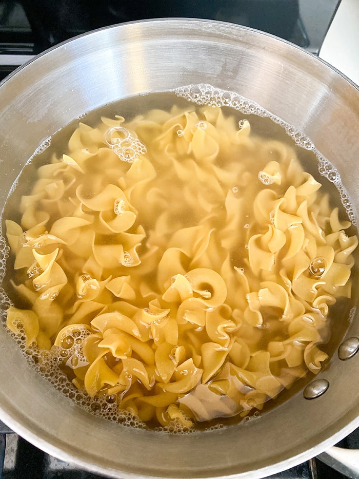 egg noodles in pot of water