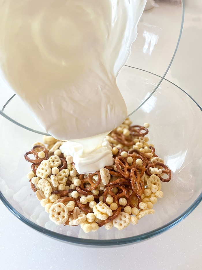 pour melted almond bark over cereal mix