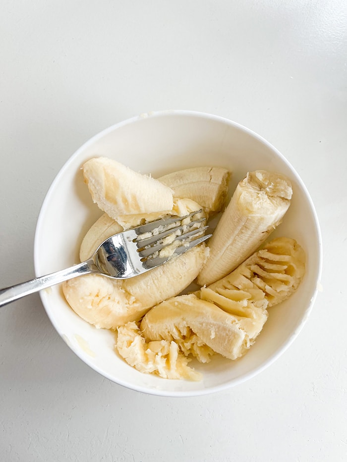 mash bananas in bowls