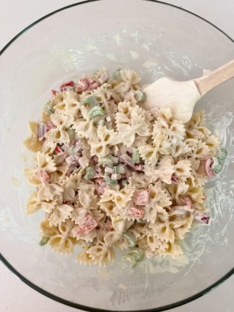 stir bow tie pasta salad in large bowl