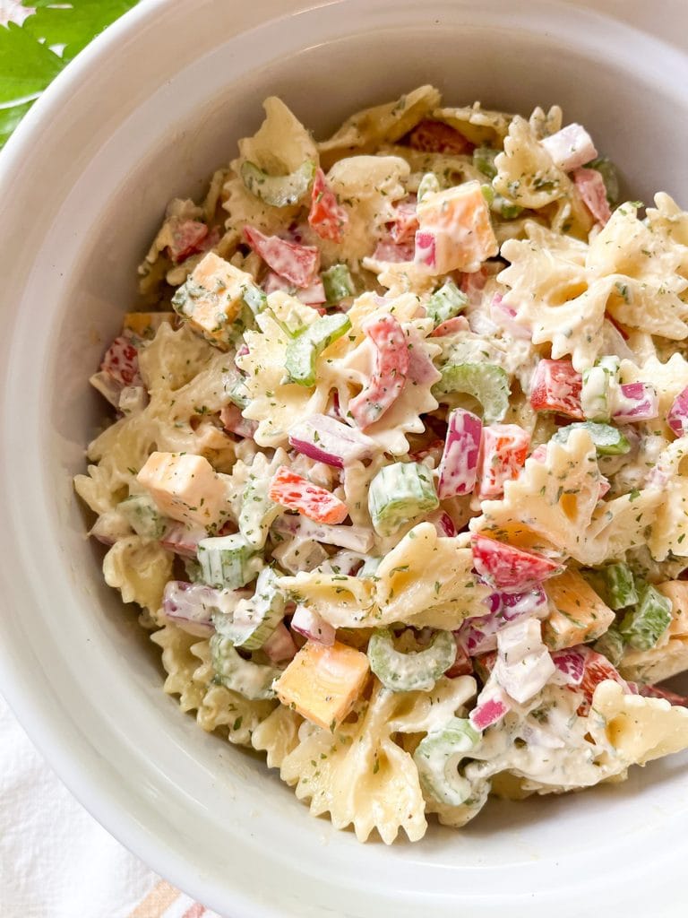 transfer bow tie pasta salad to a serving dish and serve