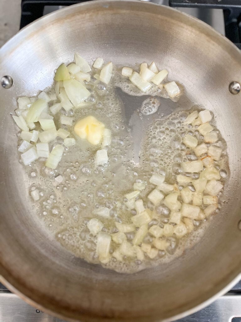 cook onion in butter in pan