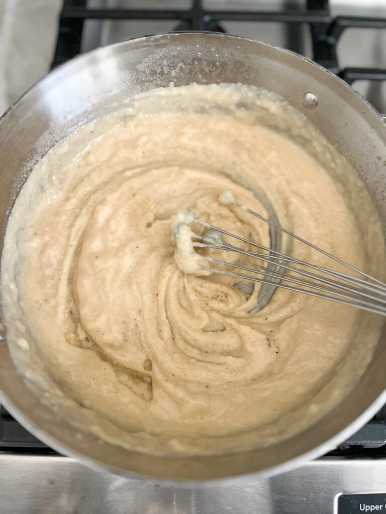 stir in flour and chicken broth