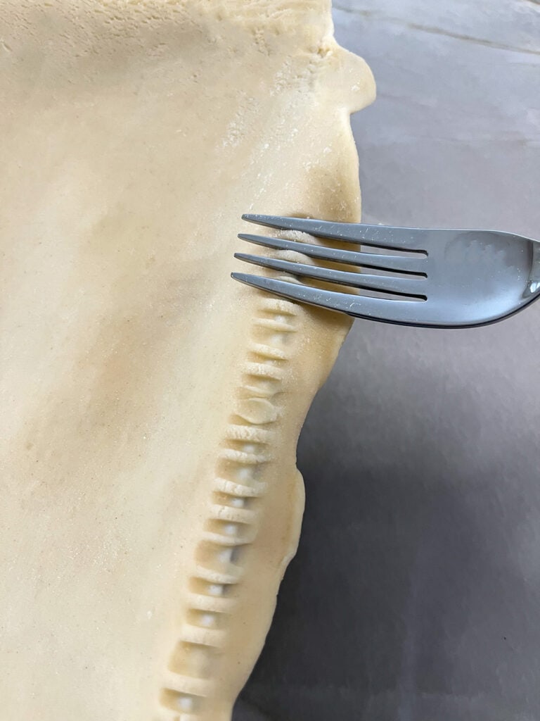 use a fork to crimp the edges of the puff pastry
