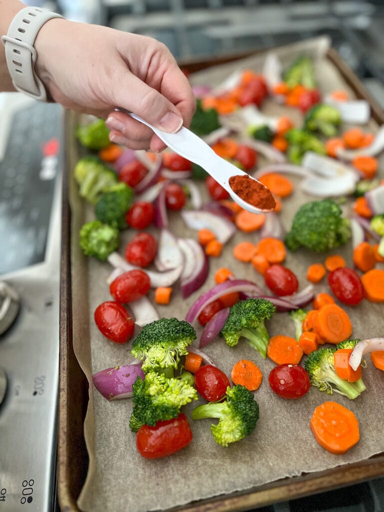 How to Roast Vegetables on a Sheet Pan: sprinkle veggies with paprika