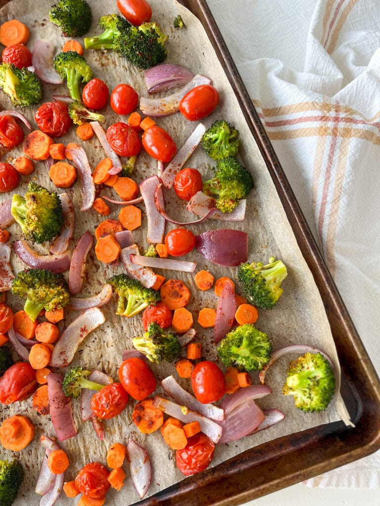 Roasted Vegetables on a Sheet Pan with napkin behind pan