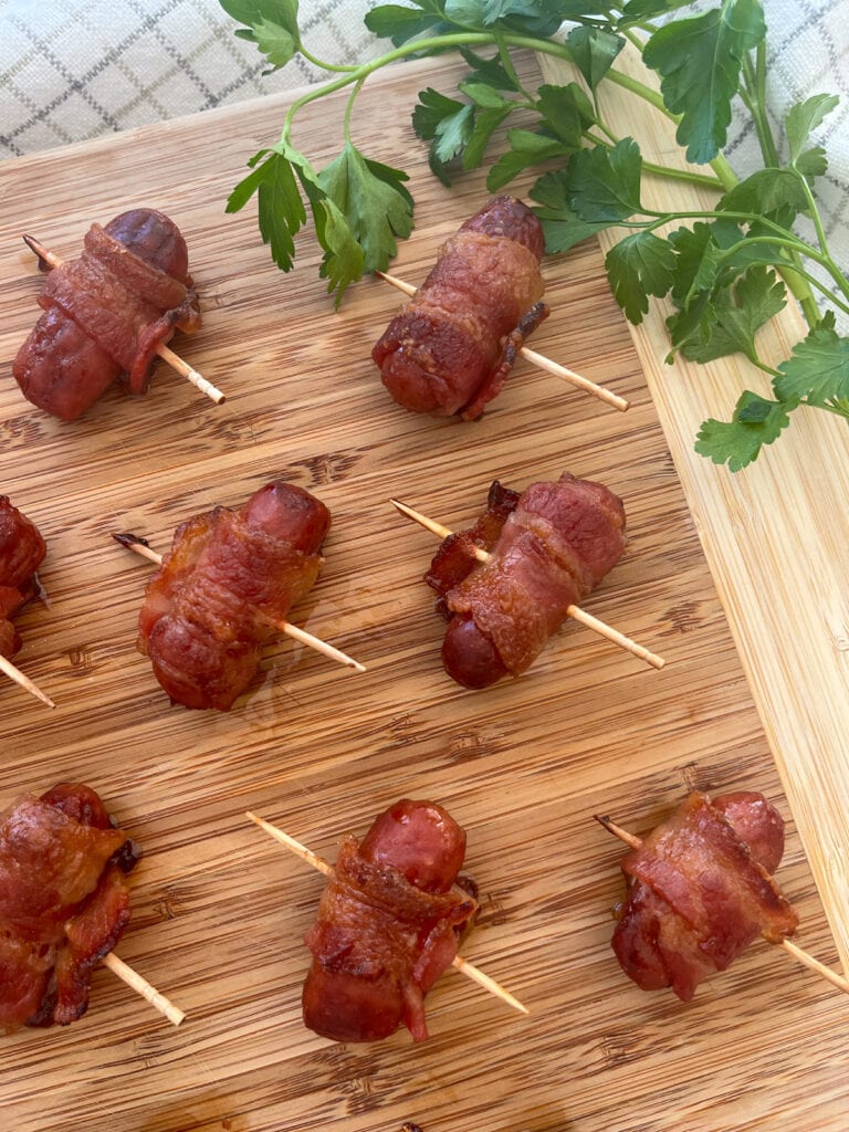 Bacon Wrapped Little Smokies on a wood tray