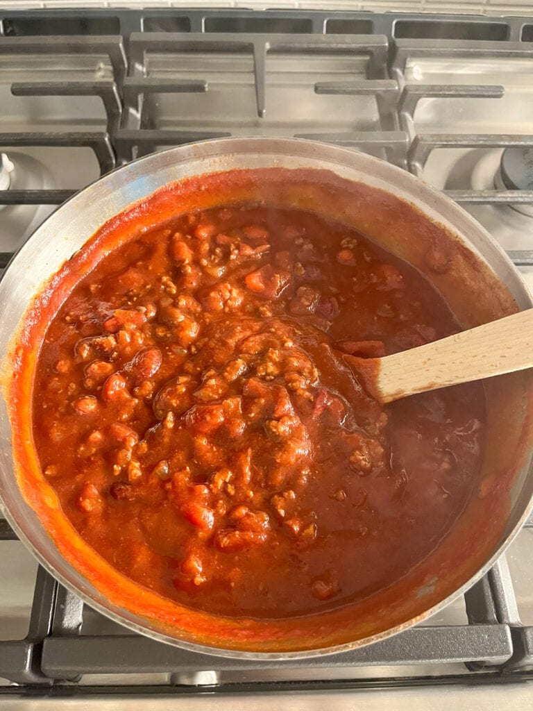 Chili with Tomato Juice cooking on the stove in a large pot