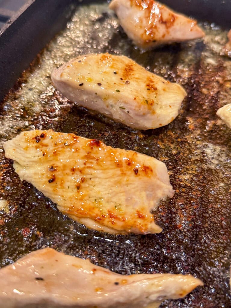 Cracker Barrel Grilled Chicken Tenders cooking and forming a glaze