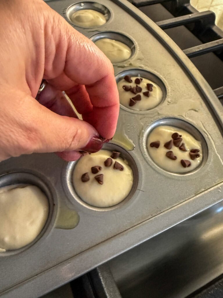adding mini chocolate chips to mini pancake bite batter