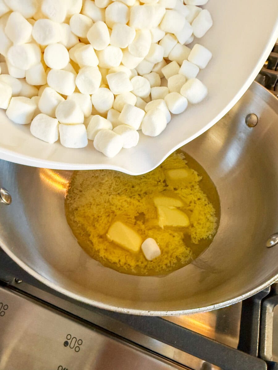 pour mini marshmallows into melted butter