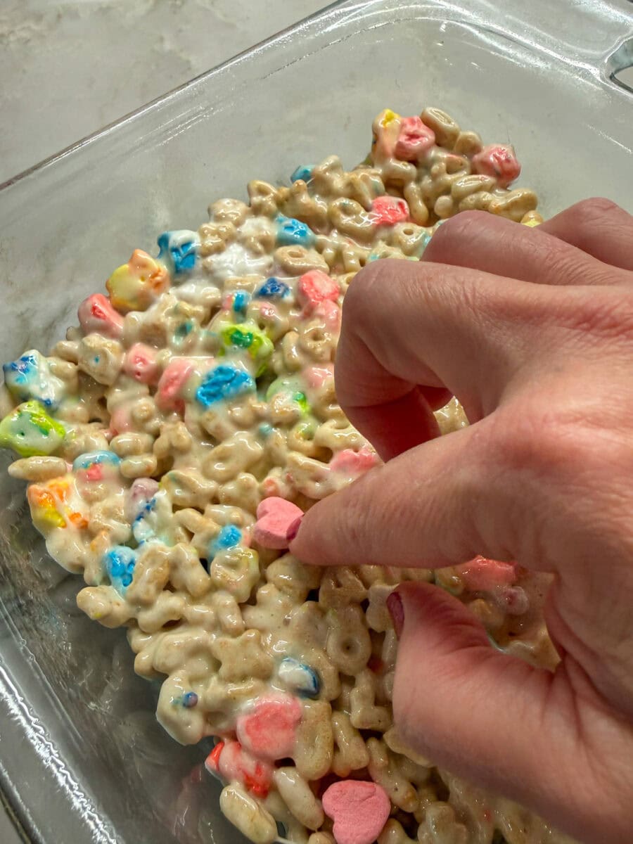 push extra Lucky Charms marshmallows into top of bars before they cool for added color on Lucky Charms Cereal Bars