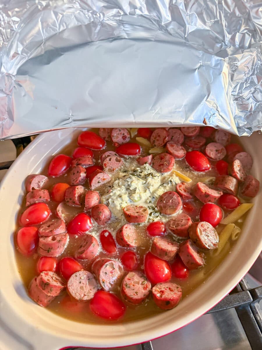 Spinach and Artichoke Dip Pasta Bake with Chicken Sausage coming out of oven