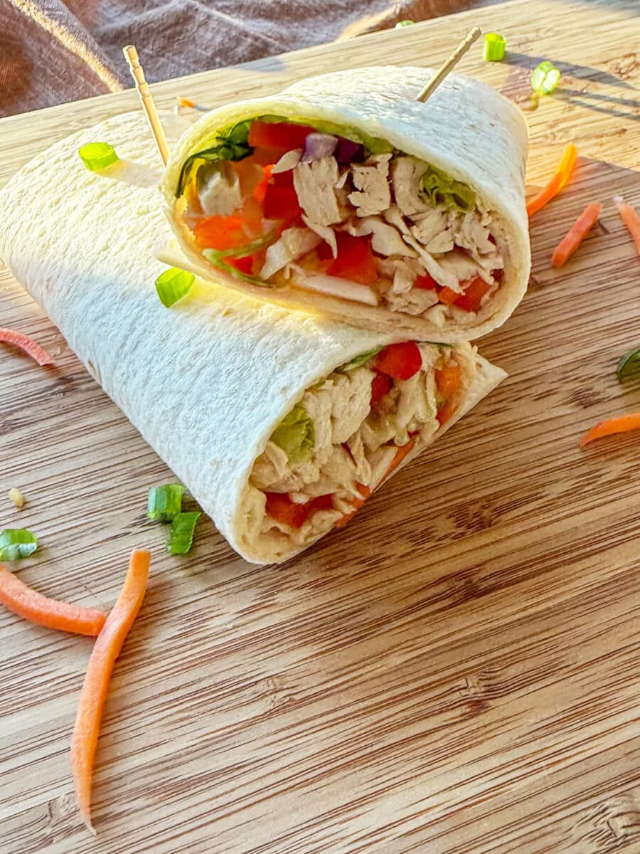 Asian Chicken Wraps on a wood tray