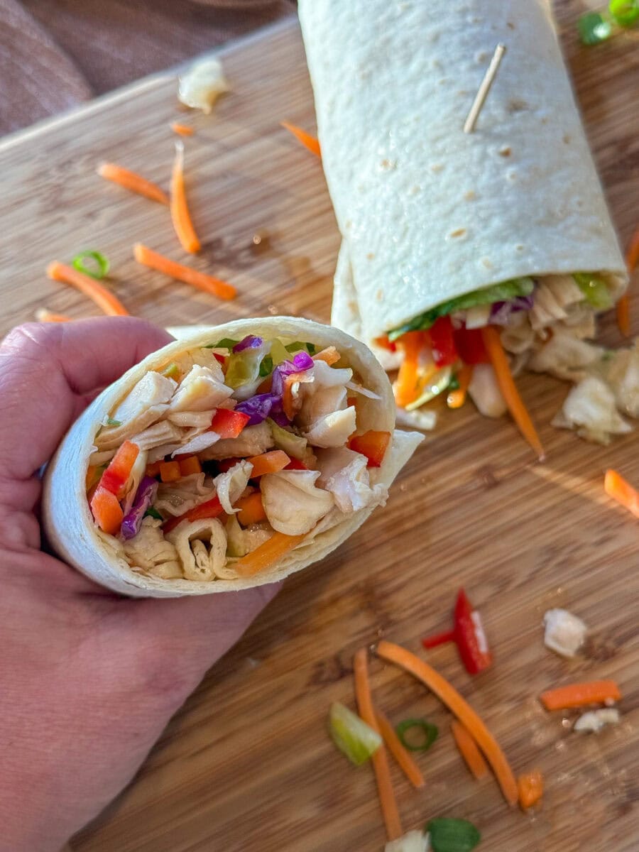 Asian Chicken Wraps on a wood tray