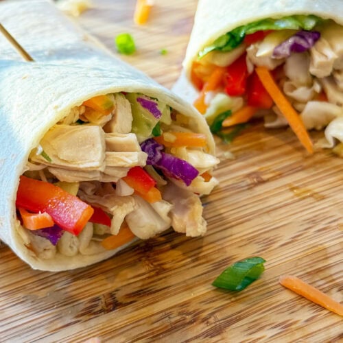 Asian Chicken Wraps on a wood tray
