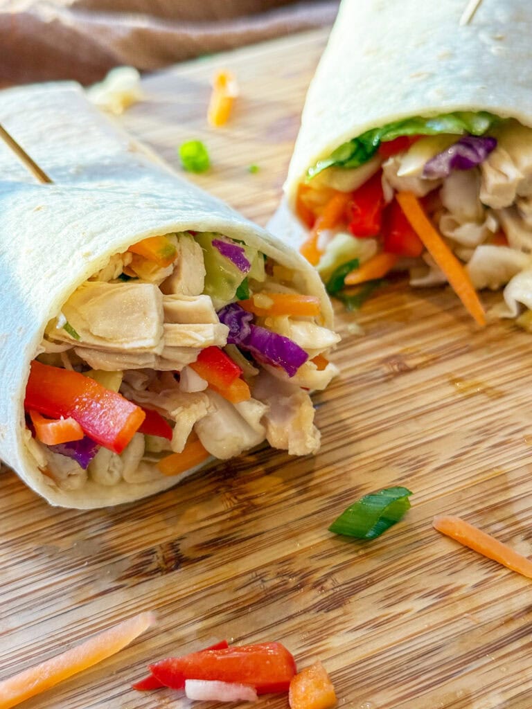 Asian Chicken Wraps on a wood tray