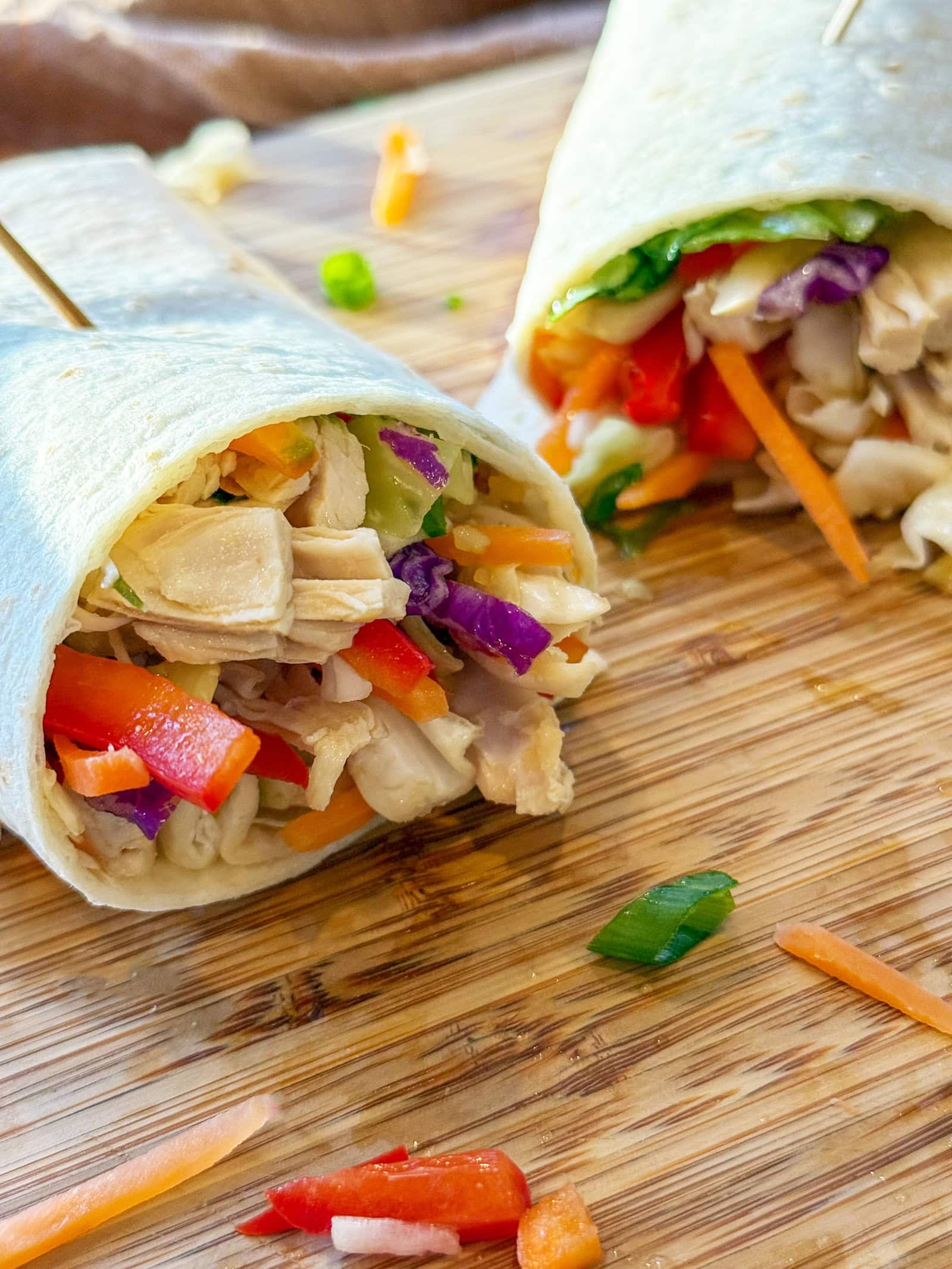 Asian Chicken Wraps on a wood tray