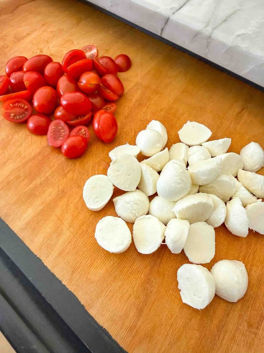 cherry tomatoes and mozzarella balls sliced length wise