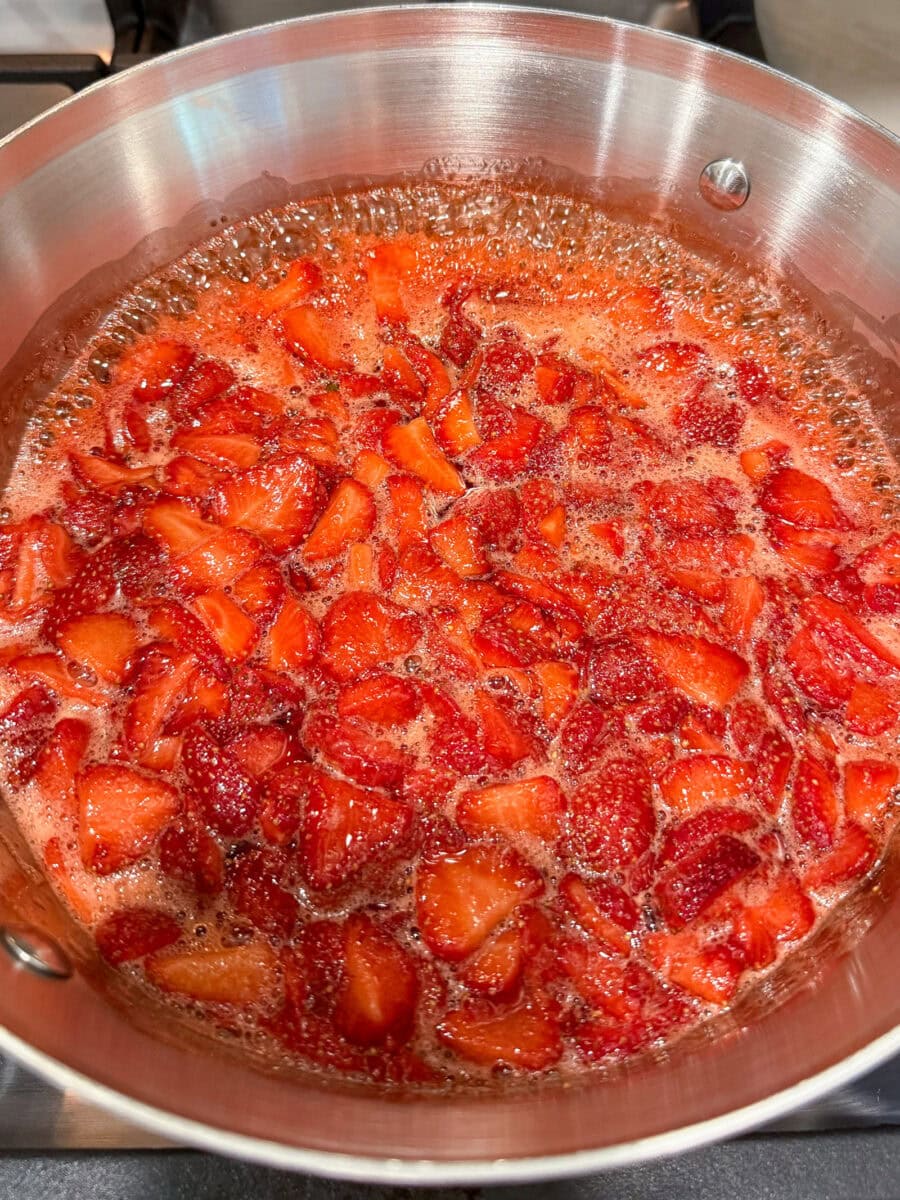 strawberry jam simmering in pan