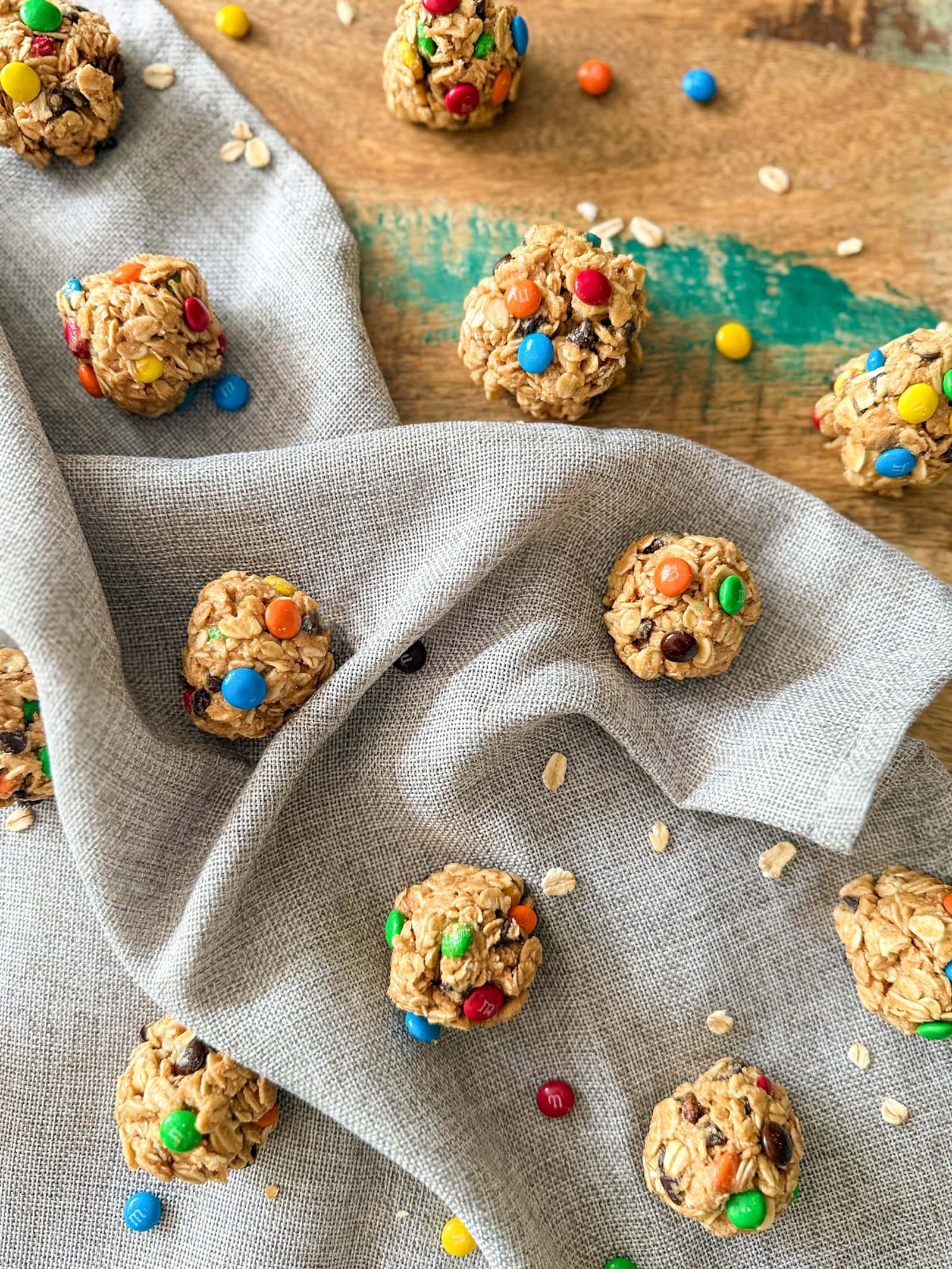 Monster Cookie Protein Balls on wood table with grey napkin